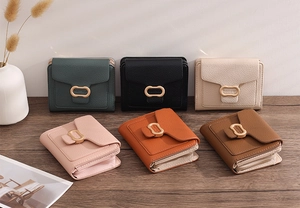 Collection of compact PU leather women's wallets with oval gold clasps in six vibrant colors