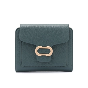Detailed macro view of dark green litchi texture leather and gold metal ring buckle