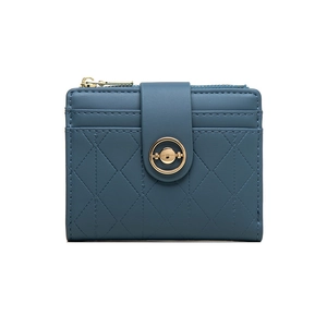 Detail of blue short wallet showing quilted stitching and metal ring closure design