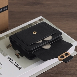 Minimalist black pebble leather wallet for women with elegant gold metal buckle