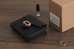 Detailed view of black litchi texture PU leather wallet with golden metal buckle and compartments