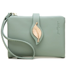 Detail view of sage green long wallet with gold leaf buckle and wrist strap