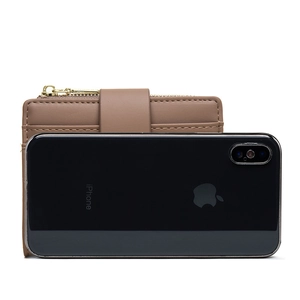Brown leather wallet size comparison with a smartphone showing multiple card slots