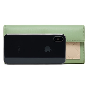 Slim long envelope wallet for women shown next to a smartphone for size scale