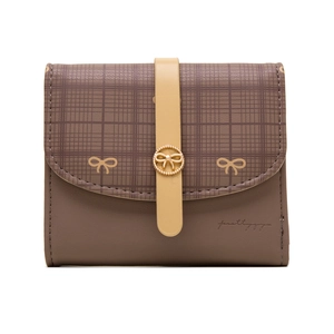 Detail of grid pattern women's wallet with metal bow buckle and PU leather texture