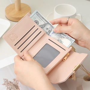 Portefeuille rose en simili cuir avec fentes pour cartes et poche zippée intérieure