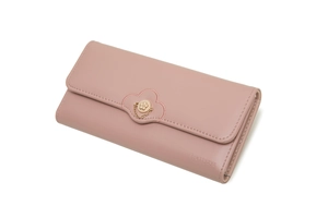 Detail of pink long wallet featuring golden flower buckle and Prettyzys brand logo