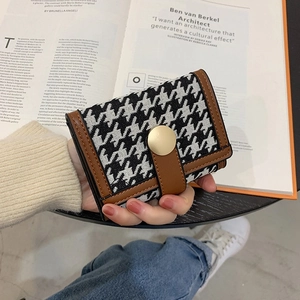 Women's houndstooth pattern folding wallet with brown PU leather trim and gold buckle