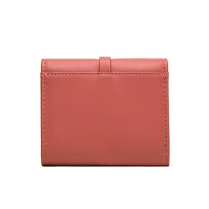 Detail of dark pink matte leather wallet showing precise stitching and strap closure