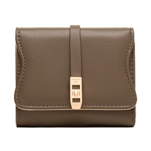 Close-up of brown leather wallet featuring rose gold metal clasp and engraved brand text
