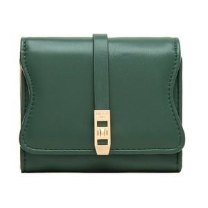 Macro detail of dark green pebbled leather wallet with gold metal clasp closure