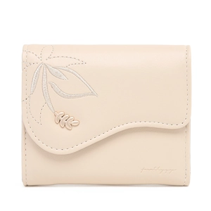 Detail view of cream trifold wallet with floral embroidery and gold leaf metal buckle