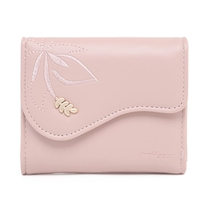 Close-up of pink PU leather wallet with leaf embroidery and golden metal charm