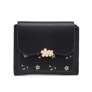 Detailed close-up of a black PU leather wallet with metallic flower charms and floral prints