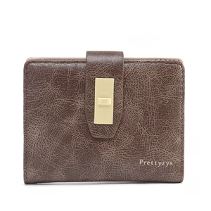 Detailed view of brown PU leather wallet featuring vintage texture and gold turn-lock