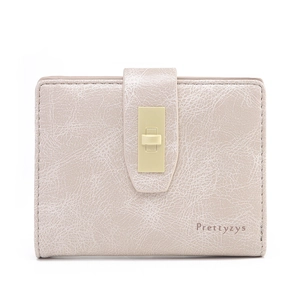 Detail of beige PU leather wallet with vintage crackle texture and golden buckle clasp