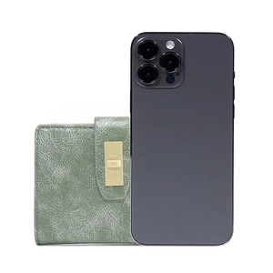 Detailed comparison of light green textured faux leather wallet next to a mobile phone
