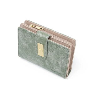 Detail of green PU leather wallet showing retro texture and gold zipper hardware