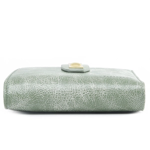 Detail of light green PU wallet featuring a unique white crackle texture and gold metal clasp