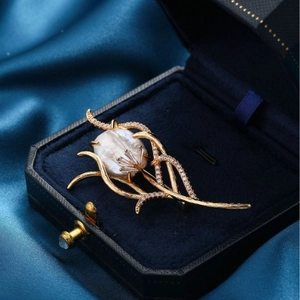 Elegant gold flower brooch with Baroque pearl and cubic zirconia in a blue velvet box
