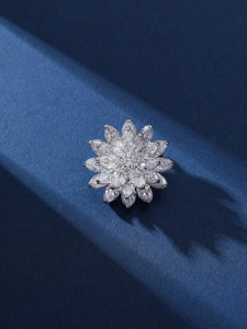 Detailed macro view of luxury three-layer lotus brooch with sparkling zircon petals