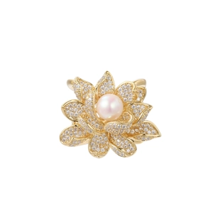 Elegant gold lotus brooch with pavé zircon petals and a central white natural pearl