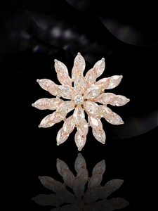 Detail of flower brooch with marquise cut pink zircons and rotating layered silver petals