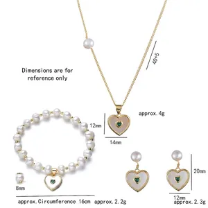 Three-piece pearl jewelry set with green heart pendants including necklace and bracelet