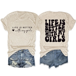 Close-up of Life is Better With My Girls slogan print on oat-colored cotton T-shirt