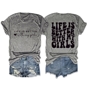 Flat lay detail of grey t-shirt with back print and distressed denim shorts