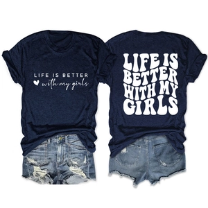 Flat lay of navy t-shirt with Life Is Better script and frayed denim shorts