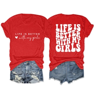Flat lay of red cotton T-shirt with 'LIFE IS BETTER' print and distressed denim shorts