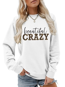 Detail of white sweatshirt with leopard print CRAZY and cursive beautiful lettering