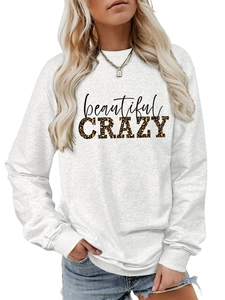 Close-up of beautiful CRAZY letter print and leopard pattern on white sweatshirt