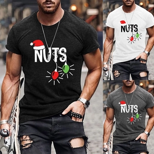 Detailed view of NUTS logo T-shirts with Christmas hat and colorful bulb graphics