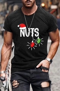 Close-up of a men's black t-shirt featuring the NUTS Christmas hat print in a street style