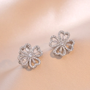 Three-piece jewelry set featuring silver clover earrings with micro-pave cubic zirconia