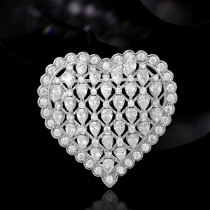 Elegant heart-shaped silver brooch with mesh pattern and cubic zirconia stones