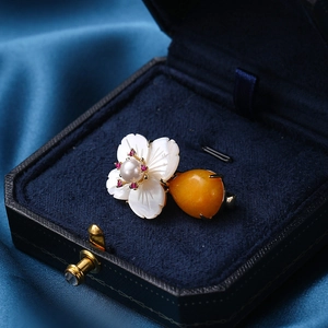 Elegant shell flower brooch with pearl and yellow pear-cut gemstone in a velvet box