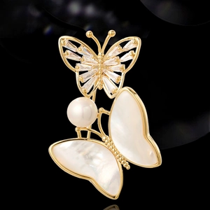 Vintage gold butterfly brooch with natural mother of pearl and baguette zircon accents