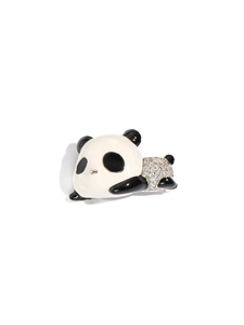 Detailed view of panda brooch with black and white enamel and shimmering micro-set zircons