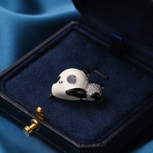 Cute panda brooch with black enamel and sparkling white zircon in a velvet jewelry box