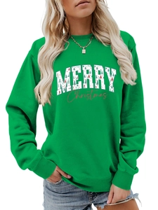 Detail of Christmas tree patterns inside Merry Christmas lettering on green sweatshirt