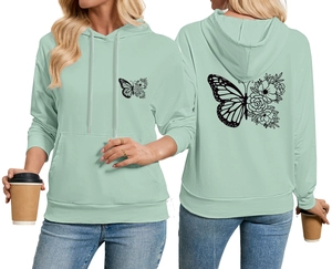 Détails du sweat à capuche vert menthe avec imprimé papillon et fleurs artistiques