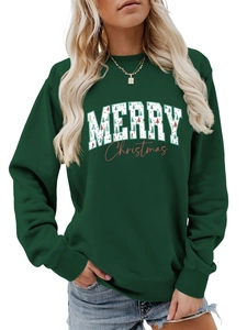 Close-up of Merry Christmas graphic with tree pattern on dark green sweatshirt