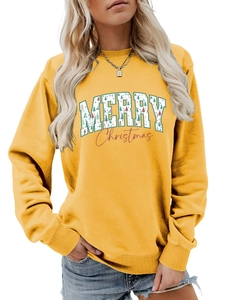Detail of a bright yellow Christmas sweatshirt featuring Merry Christmas festive graphic print