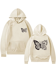 Détail du sweat à capuche beige montrant l'imprimé papillon et fleur recto verso