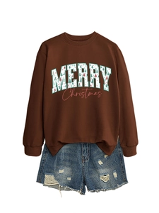 Flat lay detail of brown Merry Christmas sweatshirt with denim shorts on white background