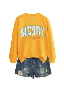 Detail of yellow crewneck Christmas sweatshirt with Merry Christmas print and denim shorts