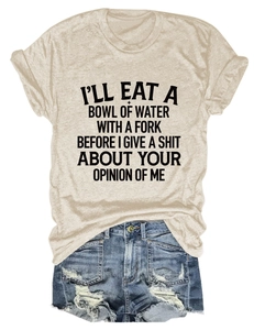 Flat lay of apricot slogan T-shirt paired with distressed ripped blue denim shorts